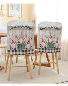 Close-up of Christmas gnome chair covers with Gnome For The Holidays text on fabric