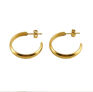 Detail of gold C-shaped hoop earrings with satin finish and butterfly backings