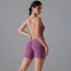 Detailed back view of dusty rose yoga romper with crisscross straps and scrunch butt design