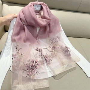 Detailed close-up of purple floral embroidery on lightweight chiffon winter scarf
