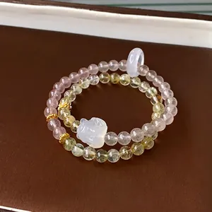 Beaded crystal bracelet set with purple and yellow stones on a leather background