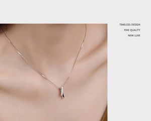 Detail of silver S925 geometric necklace with interlocking zircon and polished rings
