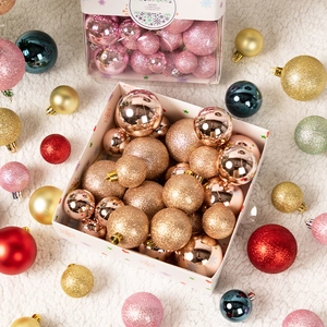 Set of 44 Christmas balls in assorted colors and finishes on white plush background