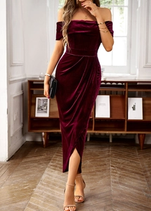 Elegant wine red velvet off-shoulder long dress with high slit shown on a model