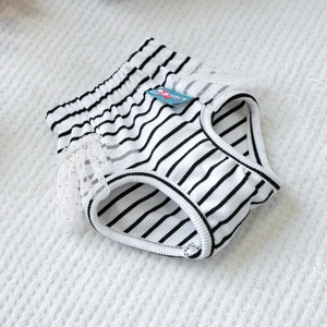 Detail showing black and white striped pet physiological pants with lace trim and elastic waistband