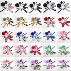 Outdoor self-defense keychain set with alarm, pompom, and marble pattern accessories