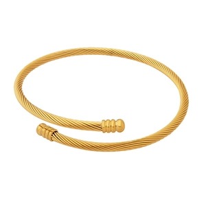 Minimalist gold twisted open bangle with ribbed caps on a clean white background