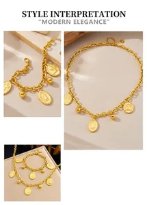 Detail of vintage gold plated stainless steel chain jewelry set with coin and cross charms