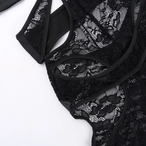 Close-up of black floral lace fabric and sheer mesh texture on sexy bodysuit