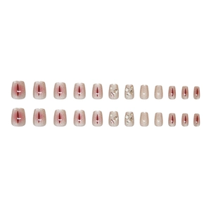 Sparkling cat-eye press-on nails in nude pink with silver stars and rhinestone accents