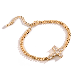 Gold plated cross bracelet with sparkling cubic zirconia crystals on a classic curb chain
