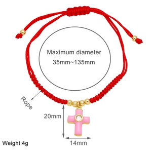 Detail view of red cord bracelet with pink cross pendant and size specifications