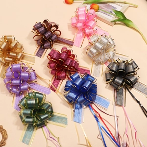 Detailed view of large textured gift pull bows in nine vibrant colors with gold edges