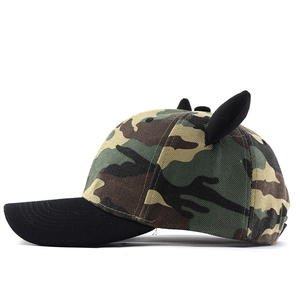 Side view of camouflage baseball cap featuring black 3D animal ears and curved brim
