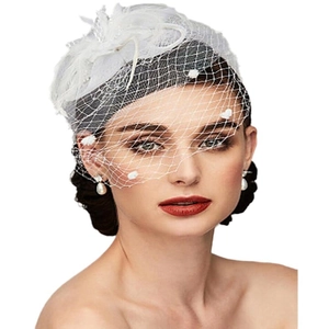 Elegant white bridal fascinator with feather flower and pearl mesh veil on white background
