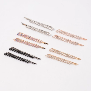 Detailed set of metal rhinestone hair clips in five assorted metallic finishes on white background