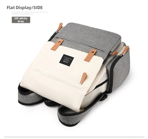 Detail of multi-functional side pocket on gray and beige LAND large capacity diaper backpack