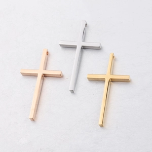 Polished stainless steel cross pendants in gold, silver, and rose gold finishes