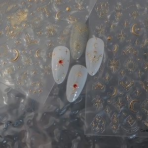 DIY gold embossed star and moon nail art stickers with celestial astrology patterns