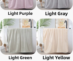Detailed grid view of plush coral fleece towels in light purple, grey, green and yellow