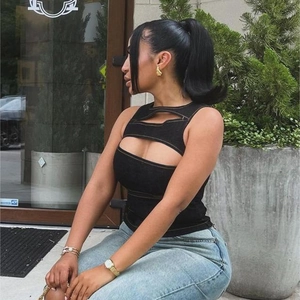Chic black cutout sleeveless crop top with orange contrast stitching and slim fit design