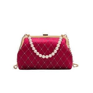 Elegant red velvet shell bag with diamond lattice pattern and pearl top handle