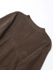 Close-up of brown V-neck knit cardigan showing fine texture and clean stitching detail