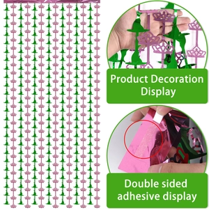 Pink and green foil fringe curtain with crown and witch hat motifs for party decor