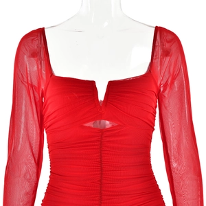 Detail of red long sleeve dress with square neck, v-cutout and mesh pleated fabric texture