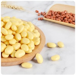 Detailed macro view of lifelike PVC artificial yellow soybeans in a wooden tray