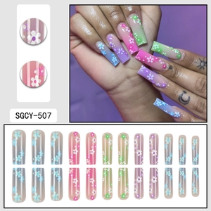 Pink gradient coffin press-on nails with 3D white flower patterns and 24-piece full set display