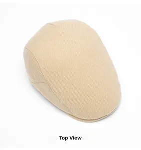 Top view of beige wool beret hat showing high-quality twill texture and minimalist design