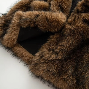Close-up of fluffy brown faux fur texture with black tips and smooth inner lining