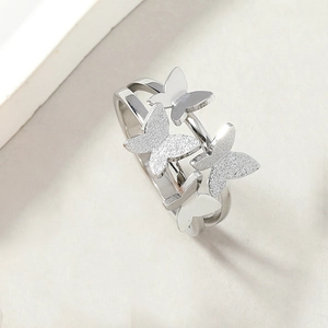 Elegant stainless steel ring featuring four frosted and polished butterflies on a double band
