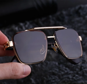 Detail view of square metal sunglasses frame with 52-20-152 size specs on dark rock
