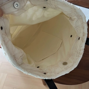 Top view of the interior compartment featuring a magnetic buckle and inner pocket