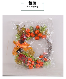 Detail of autumn harvest wreath with pumpkins and maple leaves in plastic packaging