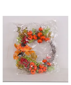 Detail of autumn harvest wreath with pumpkins and maple leaves in plastic packaging
