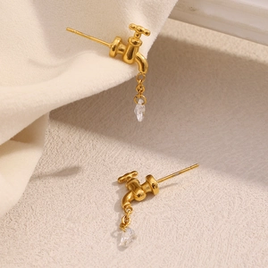 Macro shot of 18K gold plated faucet stud earrings with zircon water drop chain detail