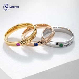 Macro shot of custom stainless steel rings in gold, rose gold and silver with gemstones
