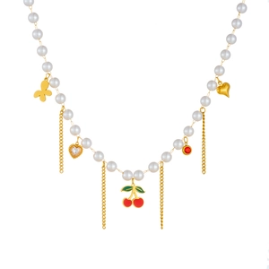 Elegant pearl necklace featuring cherry charms, gold hearts, and delicate butterfly accents