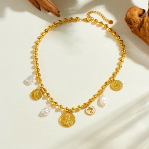Gold plated stainless steel pearl necklace with religious coin charms and cross pendant