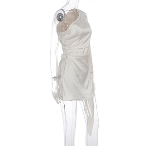 Detail view of champagne satin one-shoulder mini dress with silky smooth texture