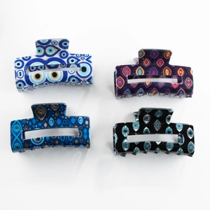Set of four rectangular evil eye hair claws in various colors with a modern hollow design