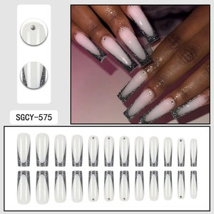 Long coffin fake nails with black glitter French tips and silver rhinestone accents