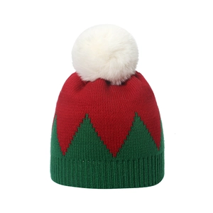Christmas knit beanie in red and green contrast stitching with white pom-pom top