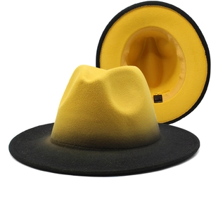Detail view of gradient wool felt fedora hats showing bicolor design and interior lining