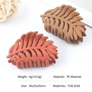 Matte leaf-shaped hair claw clips set in vintage red and khaki PC plastic material