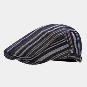Close-up of retro striped ivy cap showing textured fabric and side metal buckle detail