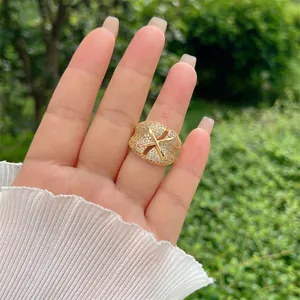 Adjustable 18K gold plated ring with crisscross X design and pavé cubic zirconia
